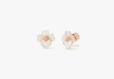 handcrafted of rose gold-tone metal and mother-of-pearl shell our precious pansy collection is true to its name. and these studs are designed with lots of thoughtful details: like the sparkly crystal centers and heart-shaped petals. did you notice the larger ones? they're a nod to our signature mark. | Kate Spade Precious Pansy Studs, Cream/Rose Gold Kate Spade Earrings, Cream Roses, Kate Spade Jewelry, Spade Jewelry, Pearl Shell, Pansies, Gold Tone Metal, Kate Spade New York, Mother Of Pearl