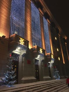 the building is decorated with christmas lights and decorations