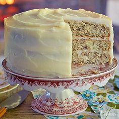 a close up of a cake on a plate with a slice taken out of it