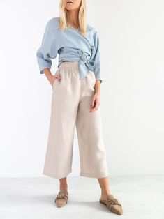 "RILEY is a wide leg cropped linen culottes. DETAILS - Cropped length - Seam pockets - Wide leg - Elasticated waist - 100% lightweight European linen fabric - Cut and sewn to order just for you in our studio COLOR - Beige, you can also choose other colors above - Fabric samples are available here https://www.etsy.com/listing/586569696/linen-fabric-samples SIZING & FIT - Fits true to size - Length is approximately 35.5 inches / 90 cm - Waist is approximately 13 inches / 33 cm - Inseam is appr Effortless Wide-leg Spring Pants, Effortless Wide-leg Pants For Spring, Effortless Wide Leg Spring Pants, Effortless Wide Leg Pants For Spring, Effortless Wide Leg Ankle-length Pants For Spring, Effortless Wide Leg Pants With Pockets For Spring, Effortless Ankle-length Wide Leg Pants For Spring, Spring Relaxed Fit Cropped Wide Leg Pants, Relaxed Fit Cropped Wide Leg Pants For Spring