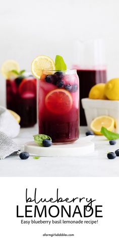 blueberry lemonade in a mason jar with fresh berries and mint garnish