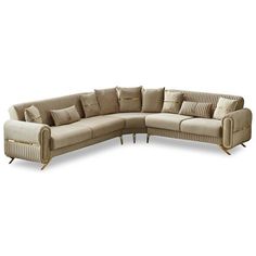 a large sectional couch with pillows on the top and bottom corner, in beige fabric