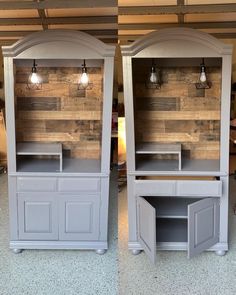 two gray cabinets with lights on them in a store