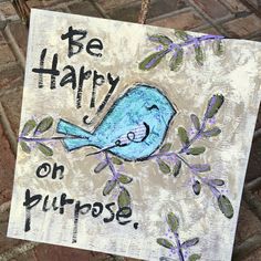 a sign that says be harry on purpose with a blue bird sitting on the branch