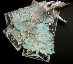 three cards with snowflakes on them