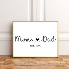 a black and white print with the words mom dad est 1909 in cursive font