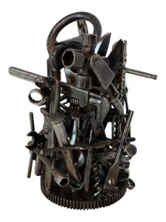 a sculpture made out of various tools and wrenches on top of eachother