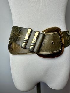 This is a neat belt from the 1990's. It's a khaki green or olive green leather with a large glossy gold buckle.  The belt does have some distressed look where the tongue has rubbed some color off where it fits into the buckle. It's not too distracting when it's fastened up.  Price will be reflected. It still looks pretty awesome the way it is. A sturdy quality belt from the 90's. Soft, semi supple feel.  ✏️✏️✏️DETAILS✏️✏️✏️ Brand: see pics Size on tag: M Fits like: same Color:  olive green & gol Big Belt Outfit, Statement Belt, Boho Trends, Trendy Dress, Dress Belt, Vintage Belts, Green And Khaki, Khaki Color, Suspender Belt