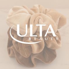 a hair scrunch with the words ulta beauty on it and an oval logo