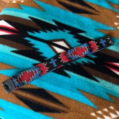 This Hatband Is Beaded In A Western Or Aztec Pattern With Blue Crosses, Measures About 24 1/4 - 24.5 Inches With The Current Leather Tie Closure, Although That Could Be Adjusted. Nwot And Great Addition To A Cowgirl Or Cowboy Hat. Beaded Hat Bands, Band Ideas, Beaded Hat, Leather Tie, Blue Cross, Handcrafted Accessories, Aztec Pattern, Hat Band, Cowboy Hat