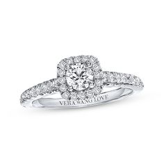 a white gold engagement ring with diamonds on it