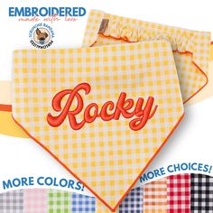 a yellow bandana with the word rocky on it in red and white checks