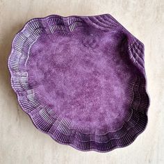 a purple plate sitting on top of a table