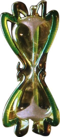 an abstract glass sculpture is shown in green and gold colors, with the shape of a vase