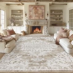 a living room filled with furniture and a fire place in the middle of the room