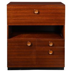 a wooden cabinet with two drawers and three brass knobs on the bottom, against a white background