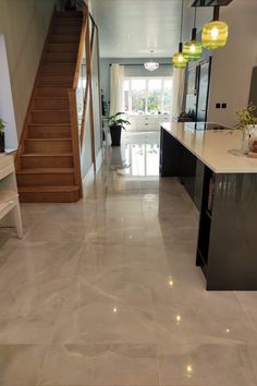 Atelier Mirror Polished large format porcelain tile lead in an open-plan kitchen and dining design. Tiles For Living Room Floor, Kitchen Tiling, Tiling Ideas, Hall Tiles, Marble Effect Tiles, Living Room Tiles, Polished Porcelain Tiles, Large Tile, Luxe Style