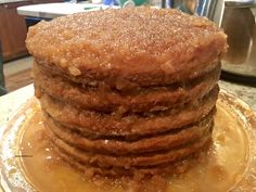 a stack of pancakes sitting on top of a glass plate