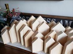 several wooden houses sitting on top of a table