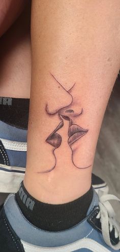 a woman's foot with a tattoo on it