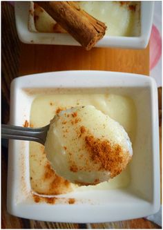 a spoon full of ice cream with cinnamon on top