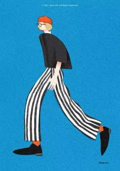 a man in striped pants is walking across the blue ground with his legs crossed and shoes on