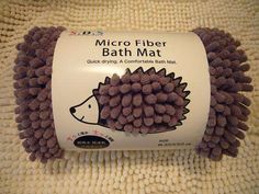 the micro fiber bath mat is made from purple balls and has a hedge design on it