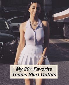 a woman in a tennis outfit standing on the street