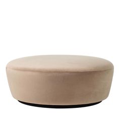 a round ottoman sitting on top of a white floor