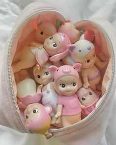 a bag filled with lots of small toy animals