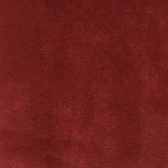 an area rug with a red color that looks like it has been made out of velvet