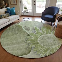 a living room filled with furniture and a sunflower rug