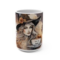 a coffee mug with a painting of a woman wearing a witches hat and holding a cup