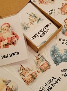 several christmas cards with santa on them are sitting next to each other in a box