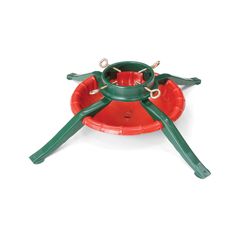 a green and red plastic bird feeder with two birds on it's legs in the shape of a spider