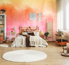 a bedroom decorated in pink, orange and white with a round rug on the floor