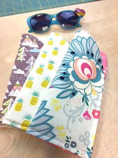 three pieces of fabric with sunglasses on them