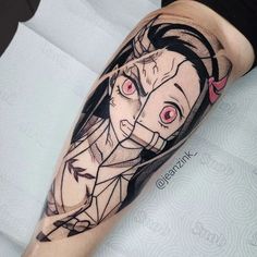 a woman's arm with an anime tattoo on it