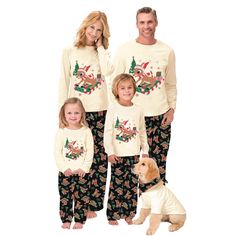 the family is wearing matching christmas pajamas