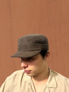 Elevate your winter outdoor style with our Brown Winter Cadet Cap, a versatile and adjustable hat inspired by military and duty ranger aesthetics. Crafted with care, this unisex brown cap seamlessly combines fashion with functionality, making it the ideal accessory for hiking, hunting, and outdoor adventures. Discover The Versatility Of Our Hat: -Classic fidel castro hat design with a modern twist -Wool construction for warmth and durability -Adjustable sun hat suitable for various head sizes -Military-style hat with a duty ranger vibe -Perfect brown soldier cap for winter expeditions -Camper hat for outdoor enthusiasts -Versatile and stylish winter hat for men and women Discover the rugged charm of our duty ranger hat, designed for those who appreciate military-inspired fashion. The deep Winter Outdoor Hats With Short Brim, Brown Wool Visor Hat, Winter Outdoor Baseball Cap, Outdoor Brown Winter Hats, Military Style Brown Hat With Curved Brim, Brown Military Hat With Curved Brim, Outdoor Flat Cap, Brown Hunting Cap, Wool Adjustable Baseball Cap For Outdoor