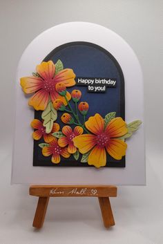 a happy birthday card with flowers on it