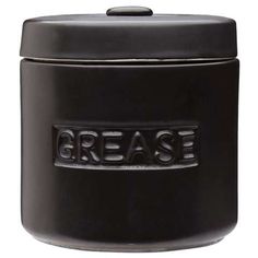 a black canister with the word grease on it's side and an inscription that reads