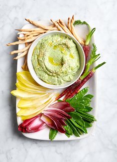 an assortment of vegetables and dip on a plate