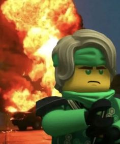 the lego movie character is in front of an explosion