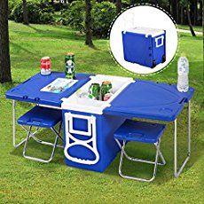 an outdoor table with two coolers and drinks on it in the grass next to trees