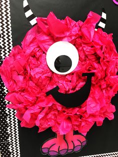 a paper plate monster made to look like it is smiling