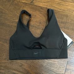 Brand New With Tags Adjustable Straps Removable Pads Medium Support Nike Activewear With Built-in Bra For Workout, Breathable Black Sports Bra, Nike Solid Sports Bra For Sports, Nike Sweat Resistant Activewear For Yoga, Nike Sweat-resistant Activewear For Yoga, Sporty Nike Activewear, Nike Black Sports Bra With Light Support, Black Sports Bra With Built-in Padding For Training, Nike Solid Color Sports Bra