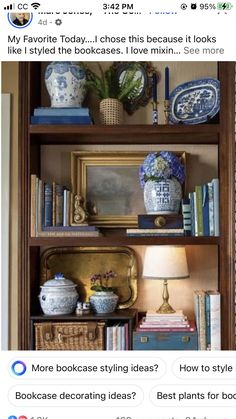 an old bookcase has been decorated with blue and white vases, books, and other decorative items