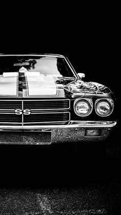 a black and white photo of a car with stripes on it's front end