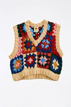 a knitted vest with flowers on it